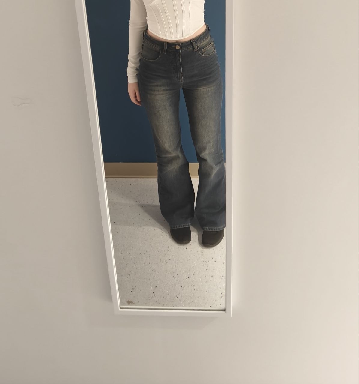 Original dark washed flare jeans photographed from the front
